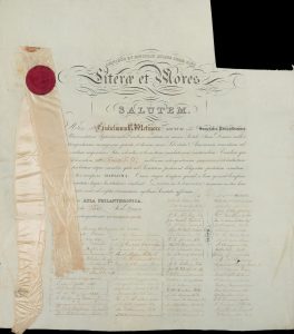A UNC Diploma from 1800 with a white ribbon, indicating membership in Phi; Southern Historical Collection