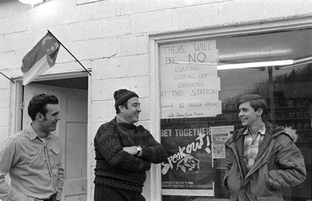 Gov. Bob Scott with young men outside Watauga County store, circa early 1970s