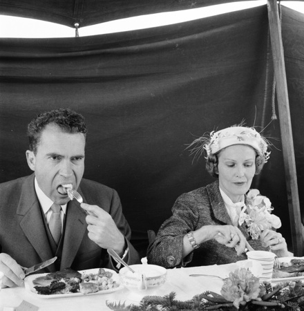 Richard and Pat Nixon, eating at unknown event, circa late 1950s-early 1960s