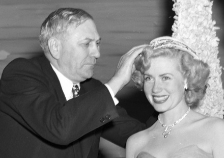 NC Governor R. Gregg Cherry crowning the first Azalea Festival Queen, Jacqueline White, in 1948