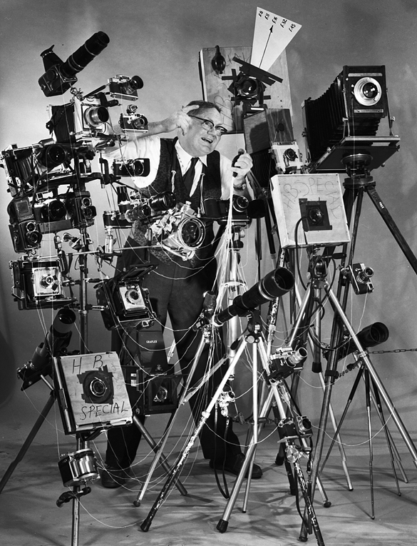 Joe Clark with a large display of cameras.