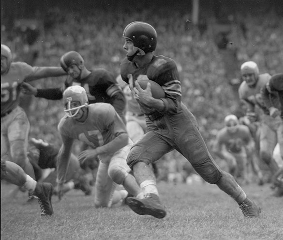 Rice right halfback Billy Burkhalter (#12), UNC right tackle Bill Kuhn (#51), and UNC Right End Ed Bilpuch (#47).  Crop from Morton's original negative for this blog post, the image appeared evern more tightly cropped—and without credit—in the January 4th issue of the Wilmington Morning Star.