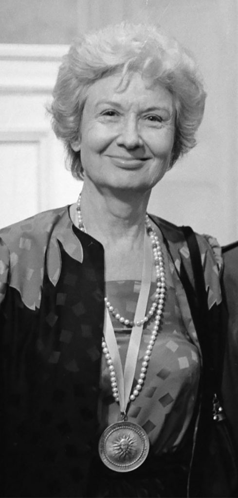 Detail of Ida Friday, from a group portrait by Hugh Morton, with her husband William Friday and their daughter Betsy after Ida received the University Medal from University of North Carolina-Chapel Hill, 4 December 1985. (Photograph cropped by the author. To see the alternate portrait visit http://dc.lib.unc.edu/cdm/ref/collection/morton_highlights/id/972.)