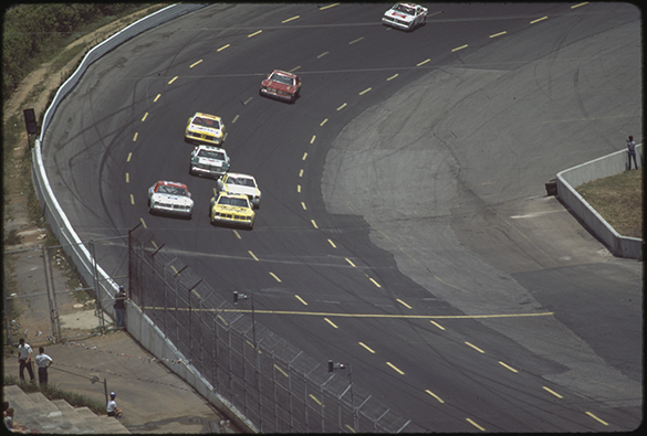 This slide, #17, shows a yellow "Wrangler" car (number not visible) with a slight edge on Neil Bonnett in car #75, the white car on the left.