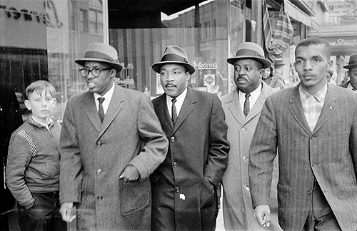 The full frame of Jim Thornton's published photograph of Rev. Douglas Moore, pastor of Asbury Temple Methodist Church; Rev. Martin Luther King Jr.; Ralph Abernathy; and Lacy Streeter, North Carolina College student and president of the NCC chapter of the NAACP.