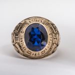 class ring with blue stone