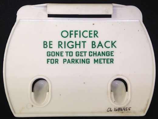 Back of Cabarrus County Fair souvenir. It reads "Officer Be Right Back. Gone to Get Change for Parking Meter."