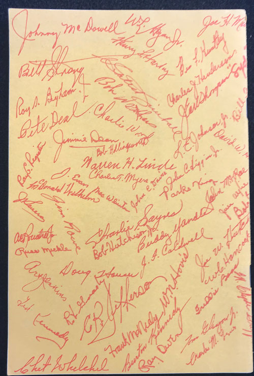 Back cover of rodeo program with numerous signatures