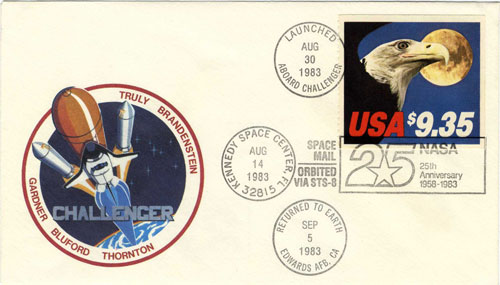 Challenger postcard with cancellations stamps noting the cards trip in space.