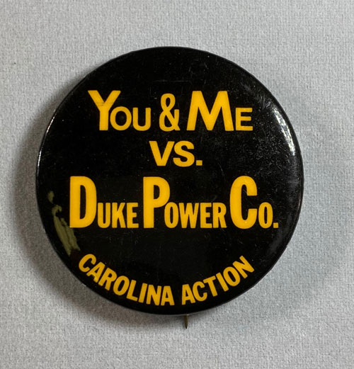 Pinback with the words "You and Me versus Duke Power Company" and "Carolina Action"