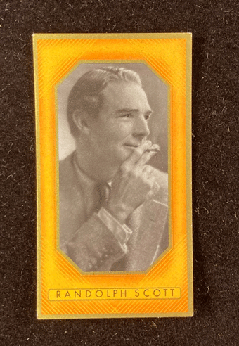 Card with black and white image of Randolph Scott smoking a cigarette.