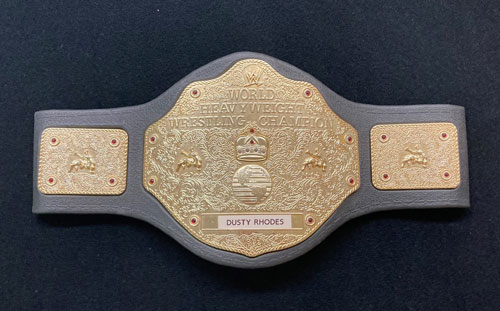 Wrestling belt with the name Dusty Rhodes in the middle.