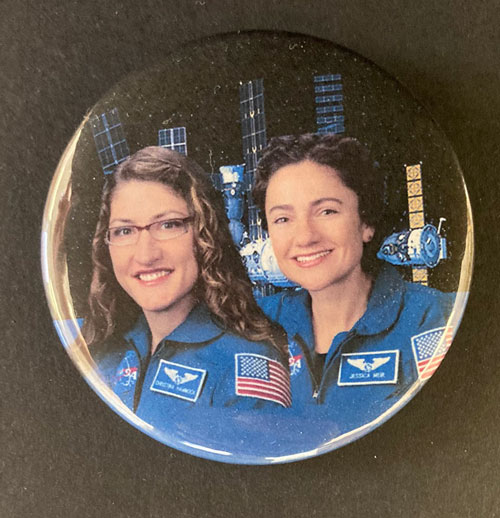 Pinback button featuring a photo of female astronauts Christina Koch and Jessica Meir.