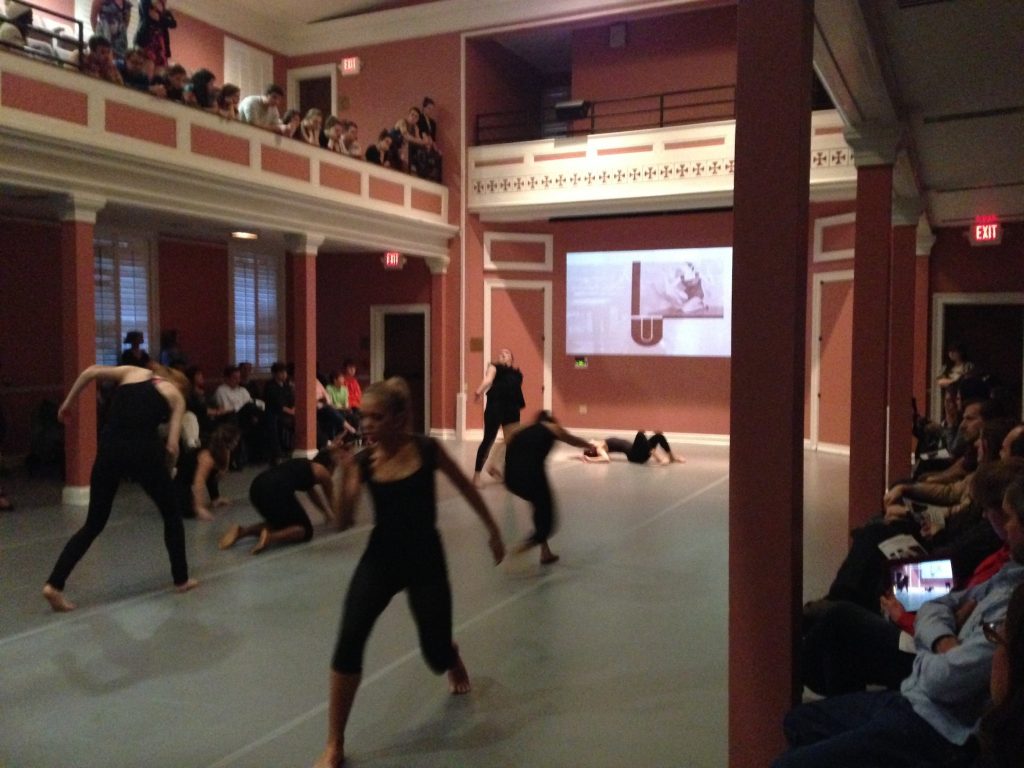 Performance with an image of Abeceda projected in Gerrard Hall