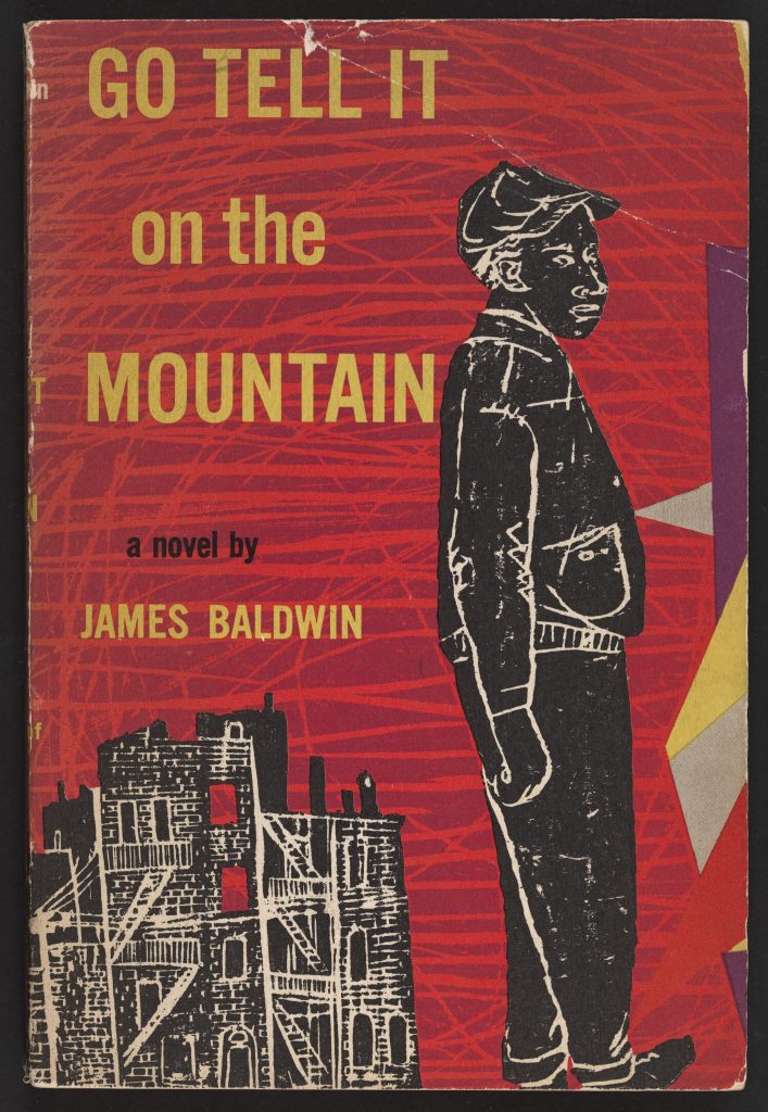 Cover of the 1953 paperback edition of James Baldwin's Go Tell it on the Mountain. Red background with stylized young boy in the foreground and red shadowed highrise building in the background.