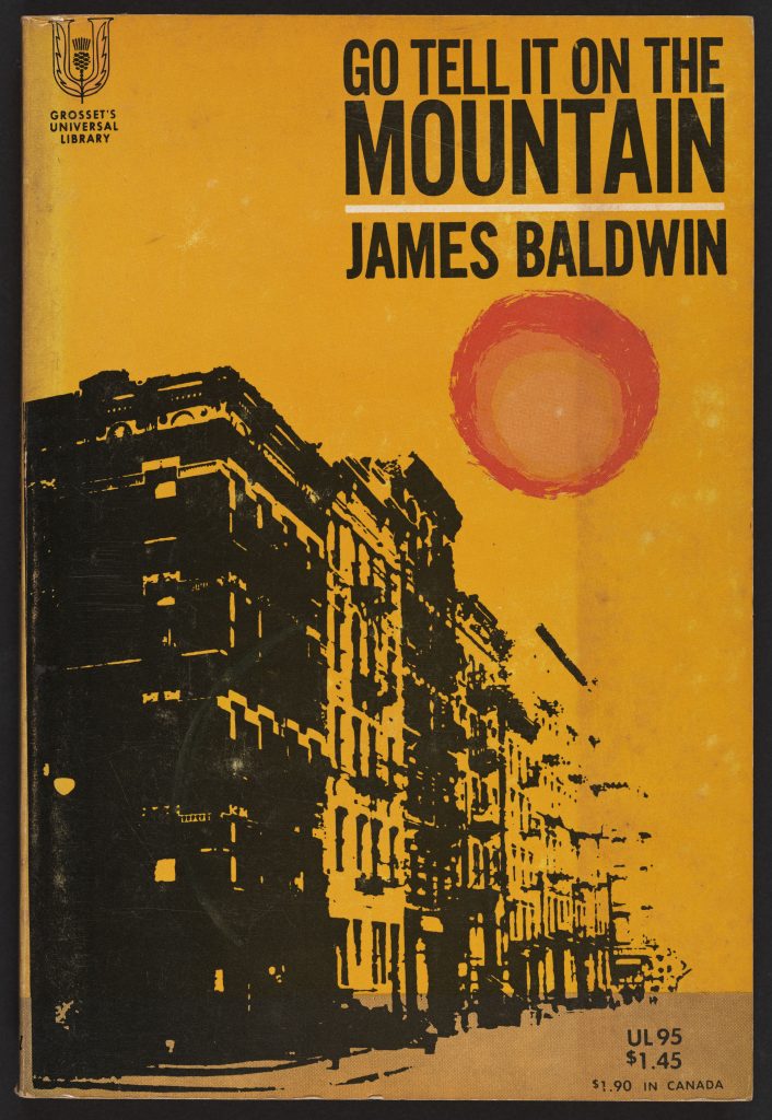 Cover of the 1953 paperback edition of James Baldwin's Go Tell it on the Mountain. Yellow background with stylized red sun and black and yellow shadowed highrise buildings.
