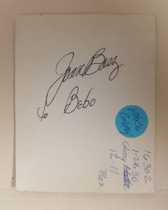 plain white card with Joan Baez autograph in cursive handwriting