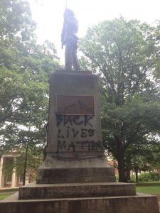 The phrase, "Black Lives Matter" sprayed on base of "Silent Sam."