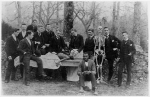 Dean of the UNC Medical School Dr. Richard Whitehead (center), medical students, and an assistant (front right) pose with a cadaver in the 1890s. From the University of North Carolina Image Collection, North Carolina Collection.