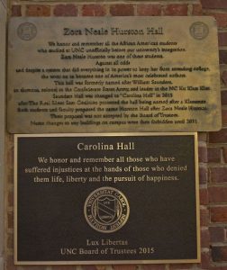 Two plaques on top of each top One states Zora Neal Hurston Hall while the other has Carolina Hall and the year 2015. 