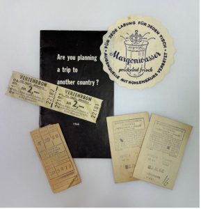 Photograph of train and ferry tickets, booklet, and German beer coaster, 1966