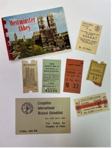 Photograph of Paper tickets to various events and locations, including Westminster Abbey, the Musee Nationaeux in Paris, the Cinerama in London, and the Casino in Lucerne. There is also a small flip book of Westminster Abbey.