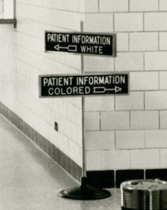 Signpost showing two signs with arrows: "Patient Information White" and "Patient Information Colored"